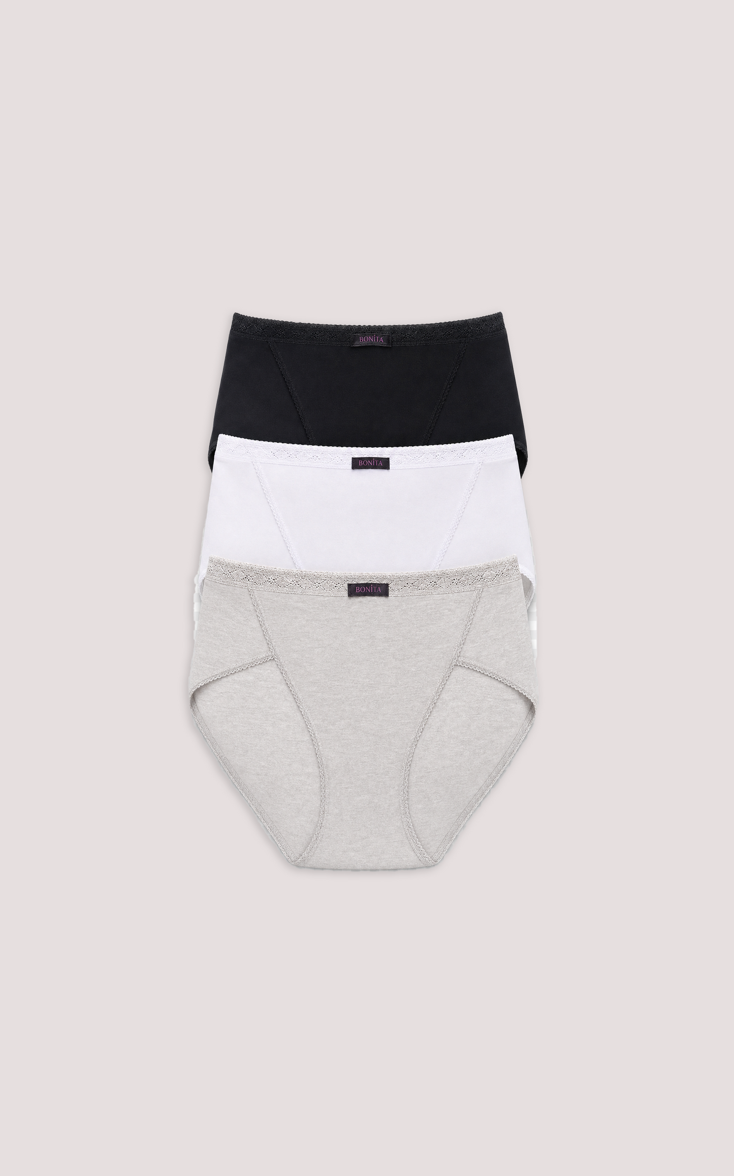 Three pairs of women's underwear in black, white, and gray on a beige background, High Cut Bikini
White, Black, Natural
Pack of 3