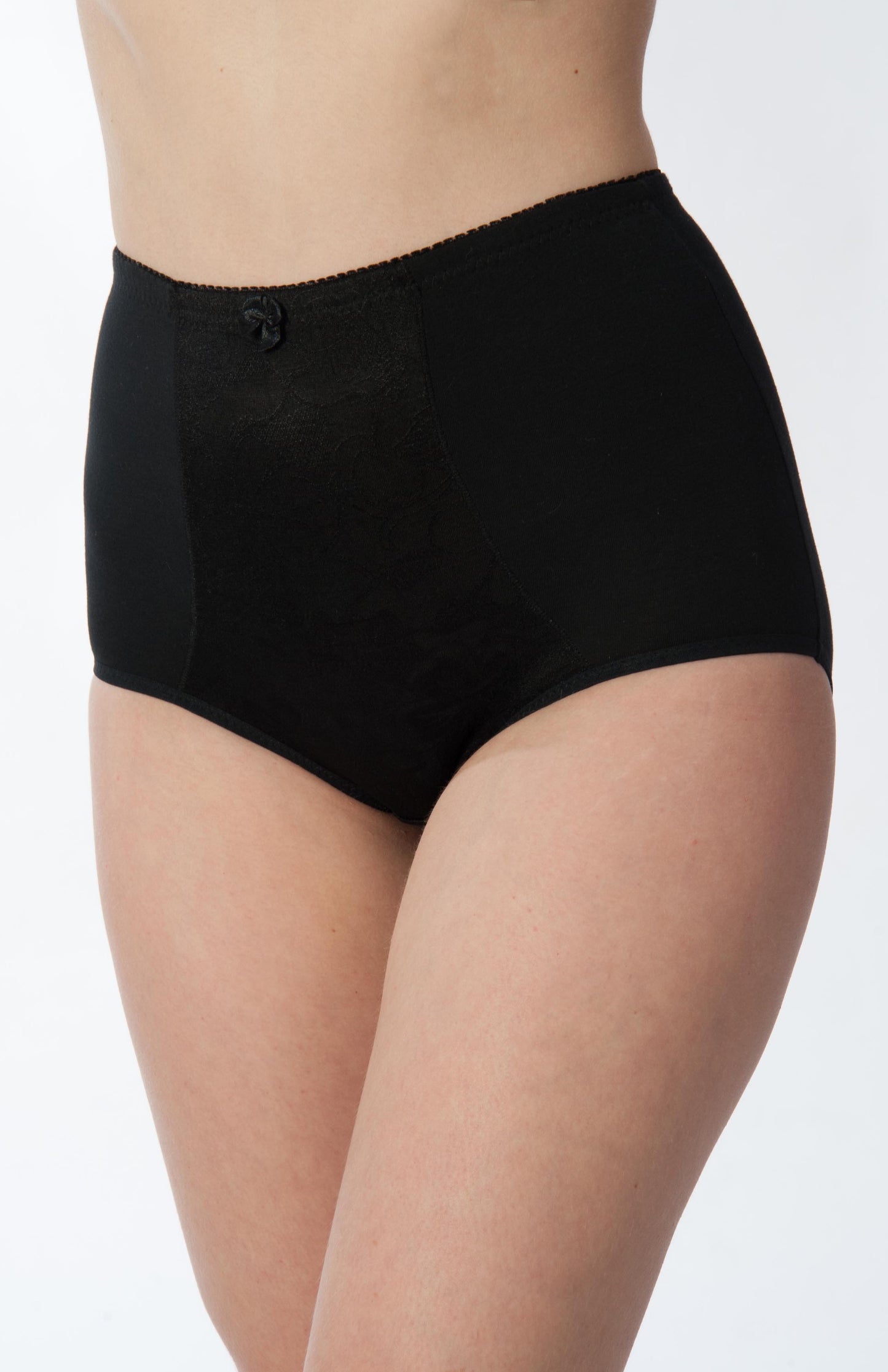 Black underwear worn by a person on a white background