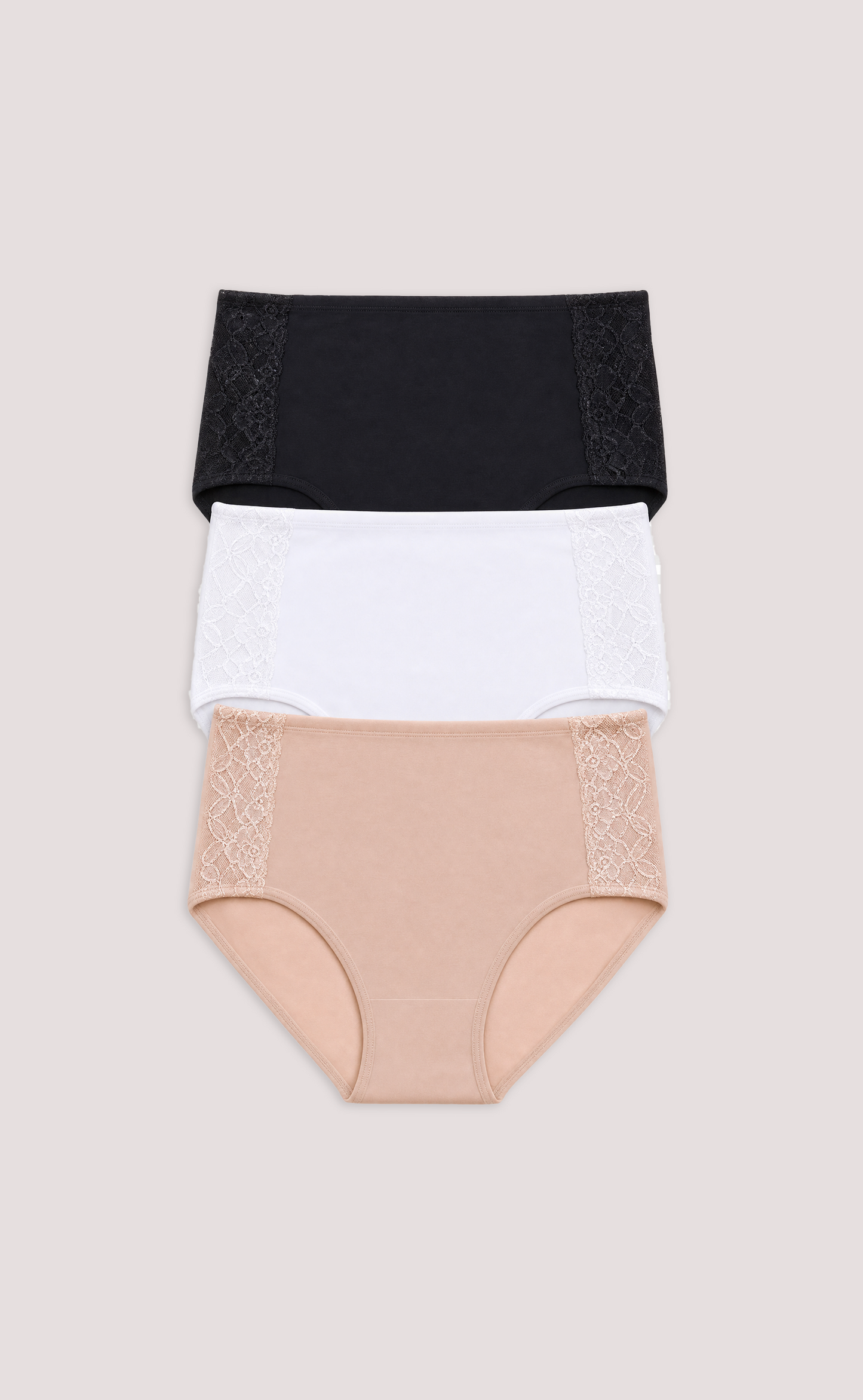 Three pairs of women's underwear in black, white, and beige on a light gray background