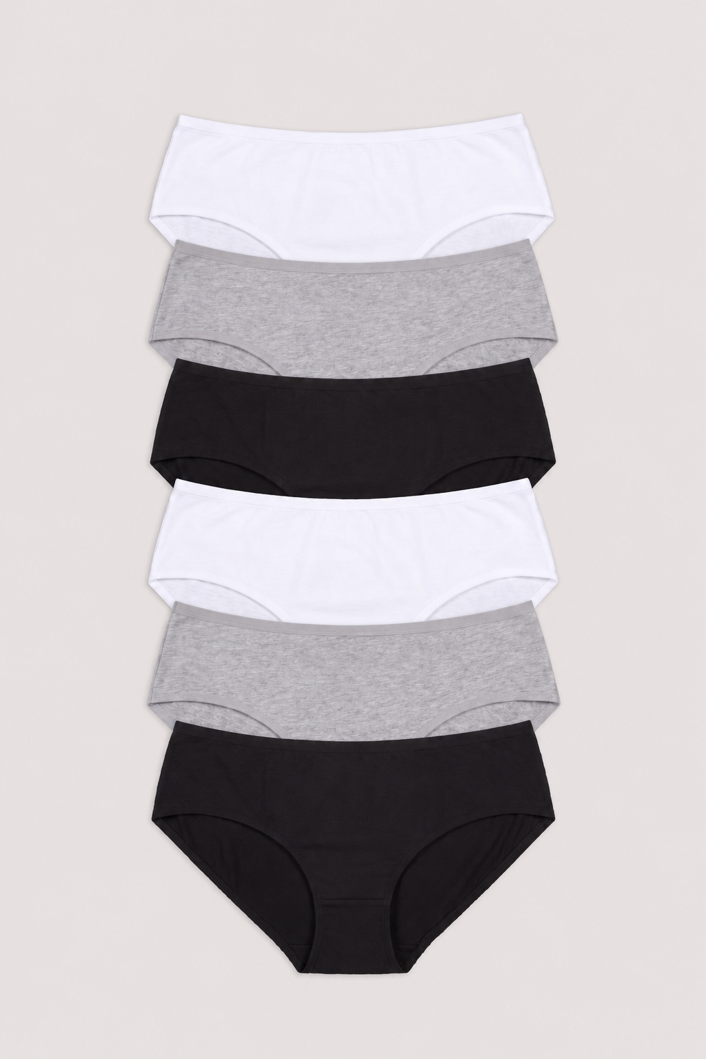 A stack of five women's briefs in alternating solid white and heather gray colors, arranged vertically on a light beige background.