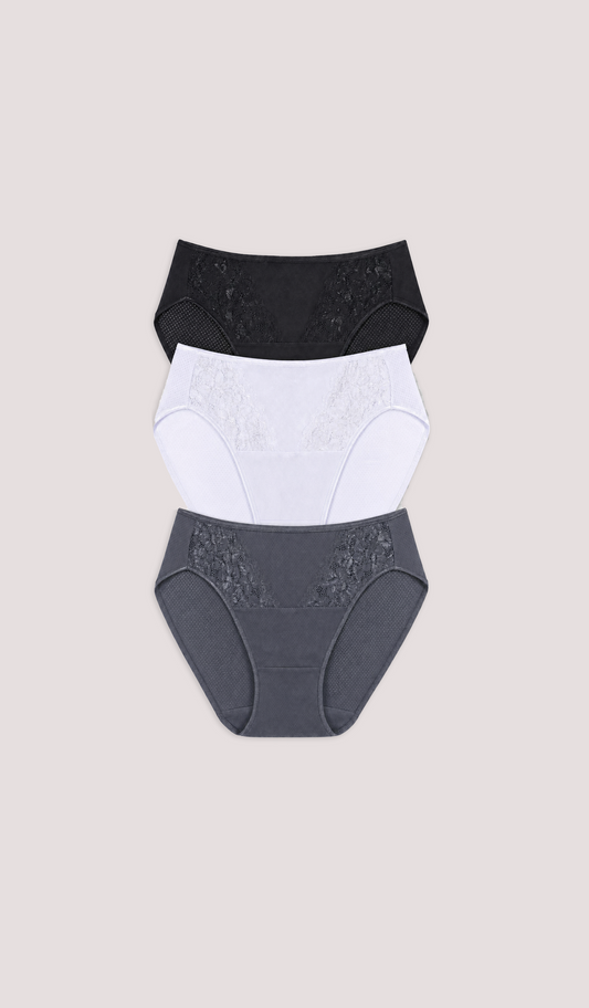 Three pairs of women's underwear in black, white, and gray on a beige background