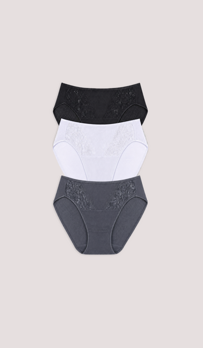 Three pairs of women's underwear in black, white, and gray on a beige background