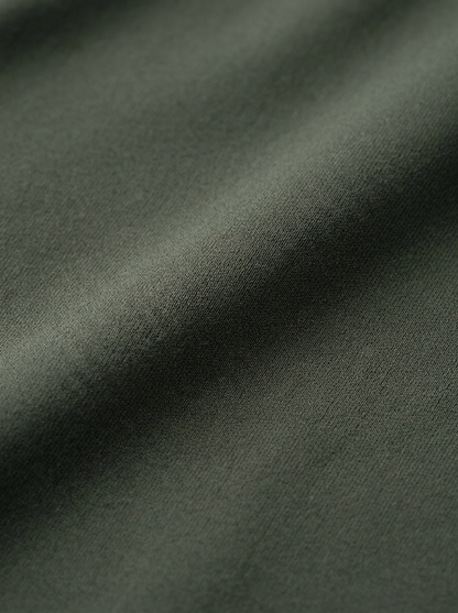 Close-up of dark green fabric texture