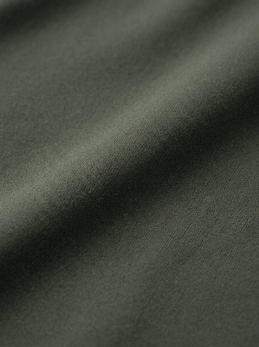 Close-up of dark green fabric texture