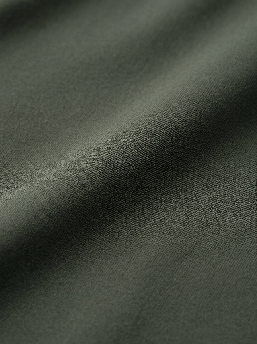 Close-up of dark green fabric texture