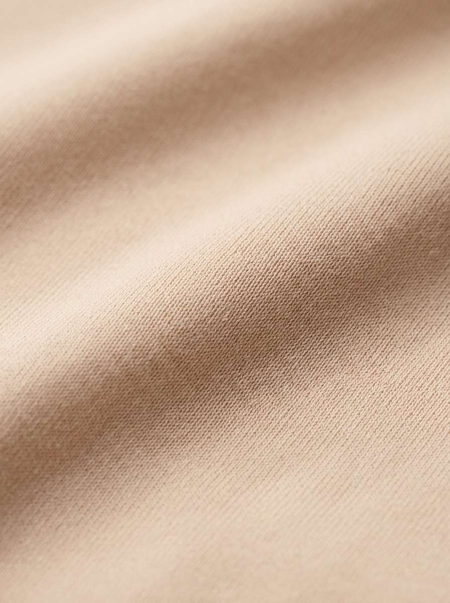 Close-up of beige fabric with subtle texture
