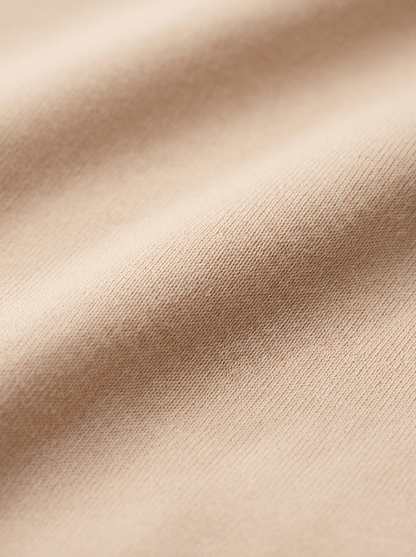 Close-up of beige fabric with subtle texture