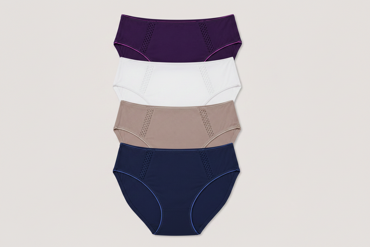 Four pairs of women's high-waisted briefs stacked vertically on a light gray background. The colors from top to bottom are deep purple, bright pink, light taupe, and navy blue, each with contrasting piping and a subtle textured mesh panel on the front.