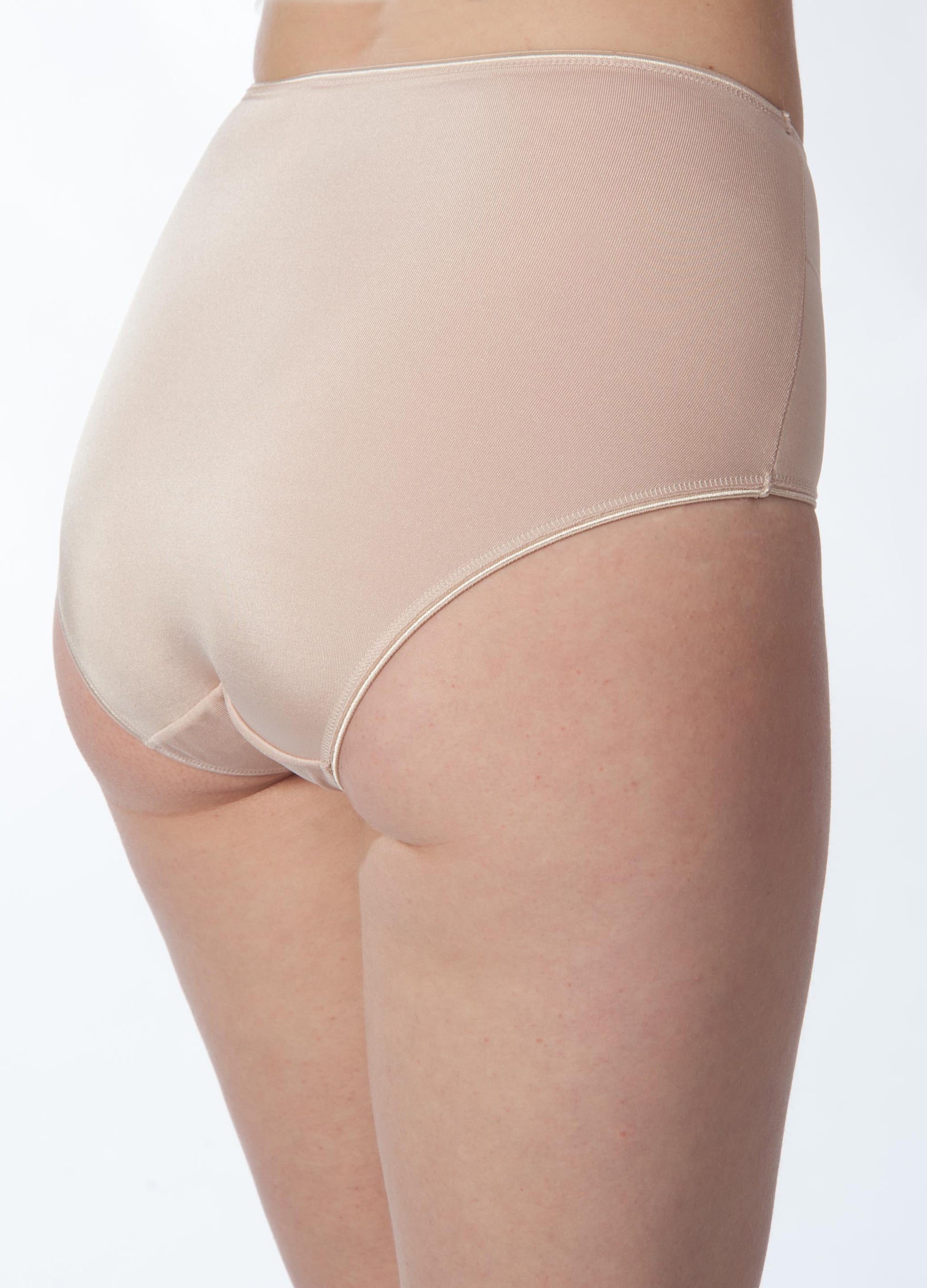 Beige high-waisted underwear on a plain background