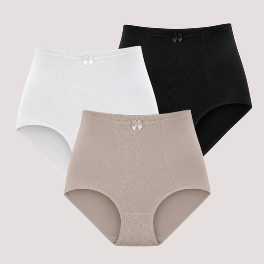 Three pairs of high-waisted seamless underwear in white, beige, and black, arranged in a triangular layout against a solid light beige background. Each pair features a subtle tonal floral jacquard pattern and a small bow detail at the center front waistband.