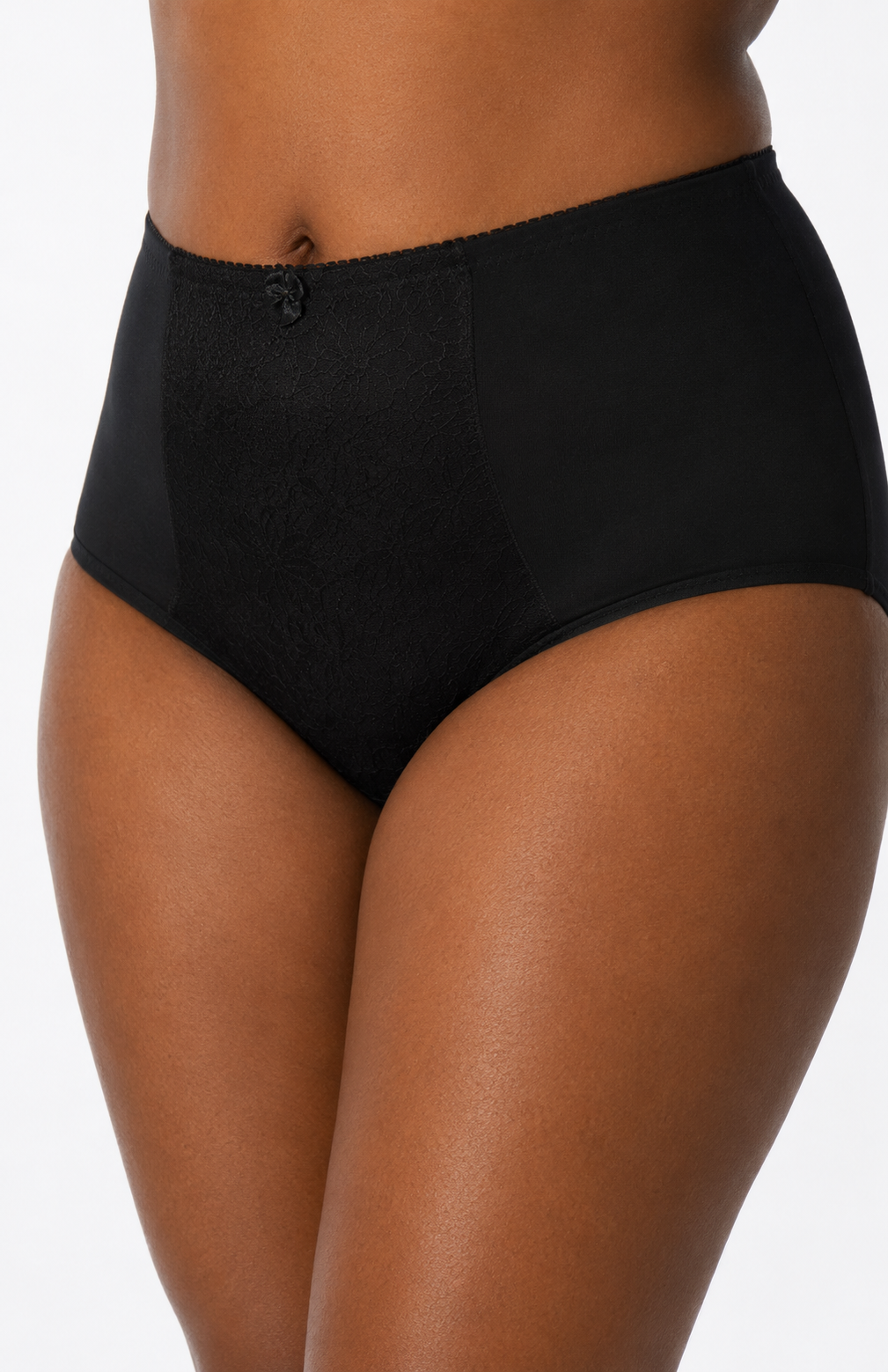 Black high-waisted underwear worn by a person on a white background