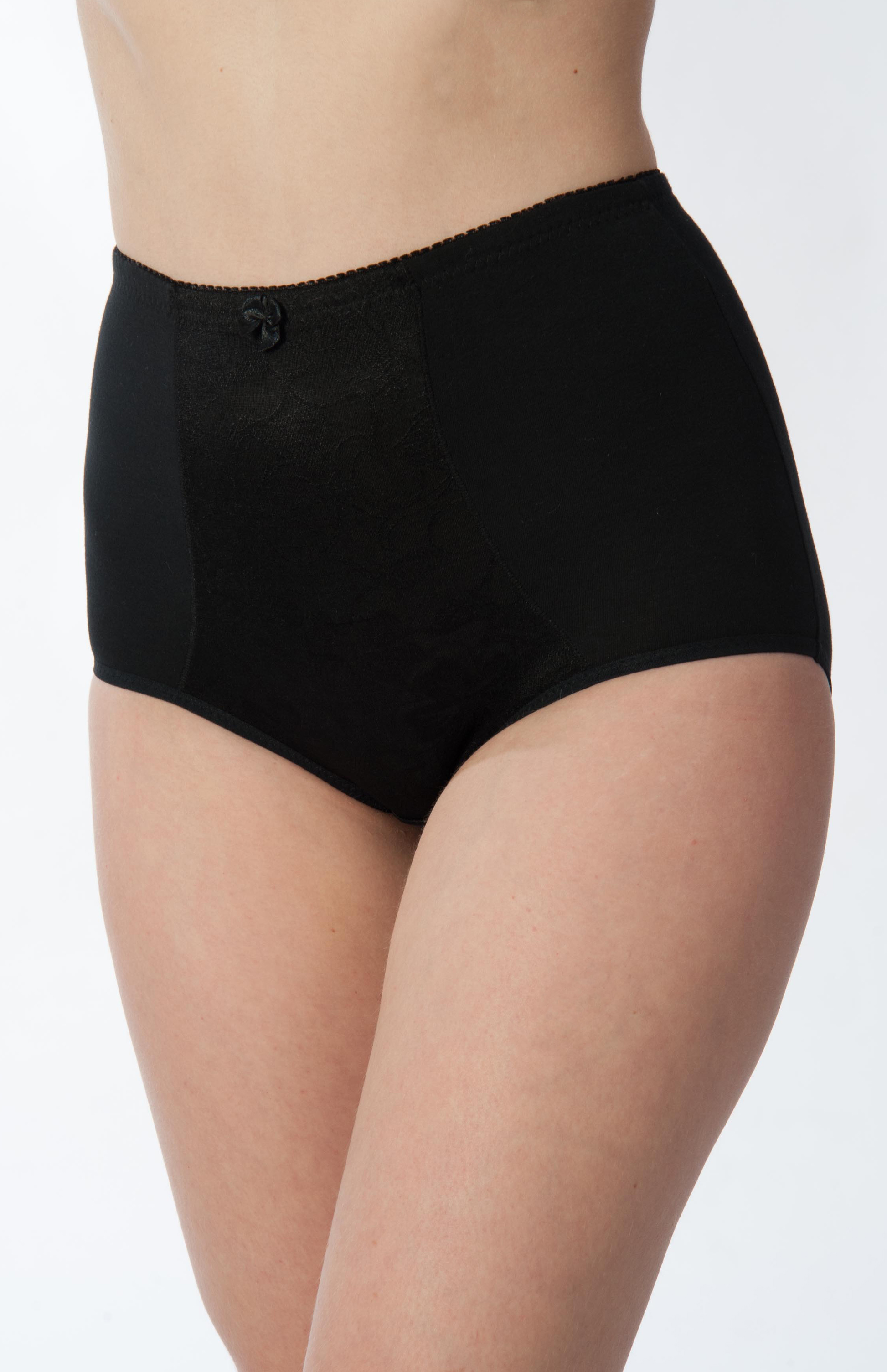 Black underwear worn by a person on a white background